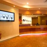 office tour reception desk with tv