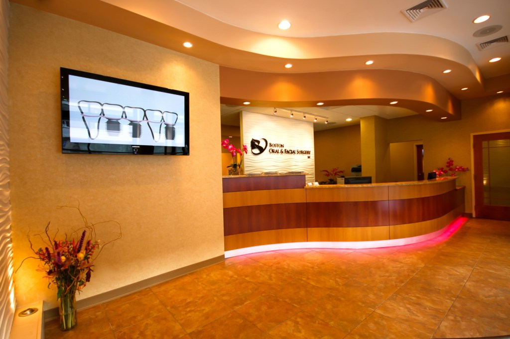 office tour reception desk with tv